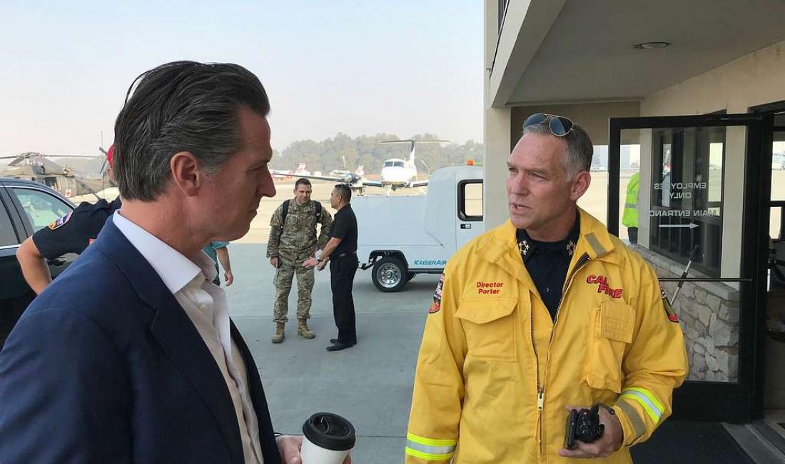 Photo from Public Domain: https://itoldya420.getarchive.net/amp/media/gavin-newsom-speaks-with-a-cal-fire-representative-during-the-kincade-fire-28def9