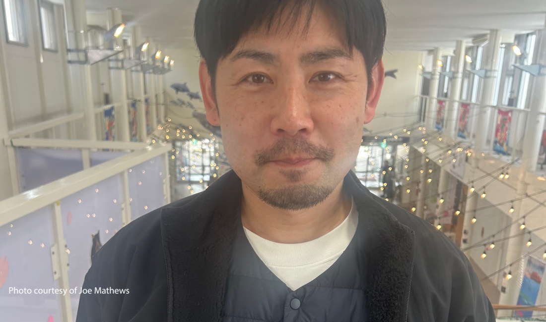 The picture depicts Yoshito Kawakado, who works for Town Creator Corporation, that handles programming at the public market.
