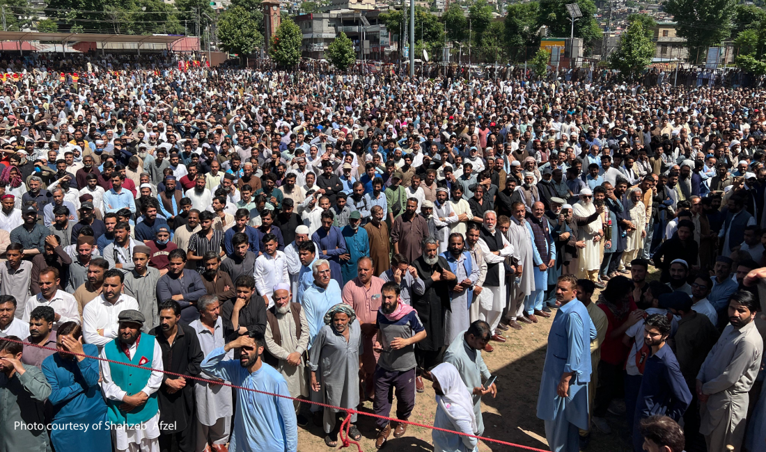 Marchers from across Azad Jammu and Kashmir gather peacefully on AJK University grounds to offer prayers for protestors killed by Punjab Rangers.