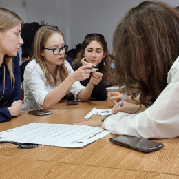 Photo of young people working together on an idea