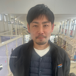 The picture depicts Yoshito Kawakado, who works for Town Creator Corporation, that handles programming at the public market.