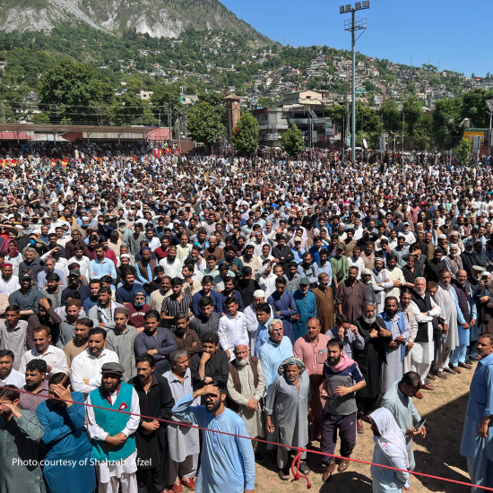Marchers from across Azad Jammu and Kashmir gather peacefully on AJK University grounds to offer prayers for protestors killed by Punjab Rangers.